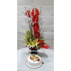 7 red Anthurium 3 white Oriental lily with dry stick + 1 Kg. Fresh Fruit cake